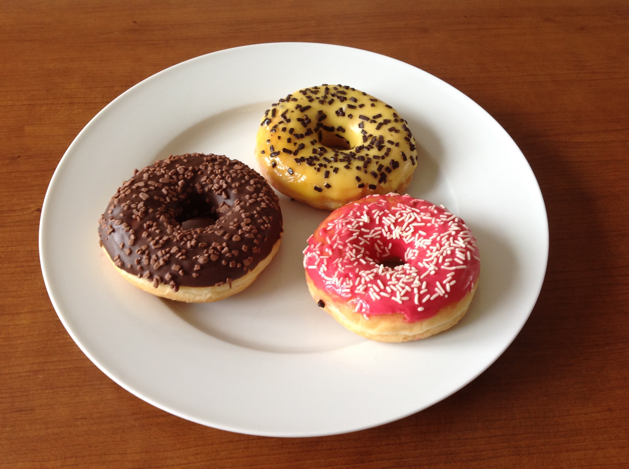 Three donuts on a plate